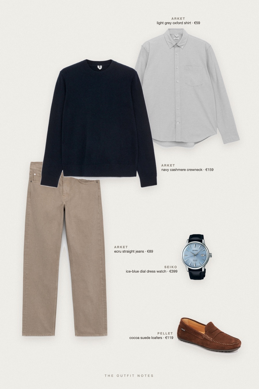 Flat-lay of the pieces in this outfit: navy cashmere crewneck, light grey oxford shirt, ecru straight jeans, cocoa suede loafers, ice-blue dial dress watch.